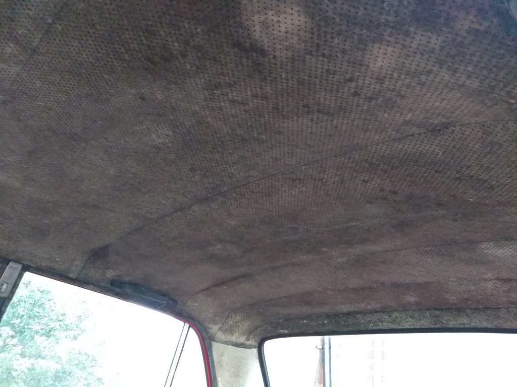 The head lining of the Lada 2101 is so moldy it's almost like something out of Chernobyl.