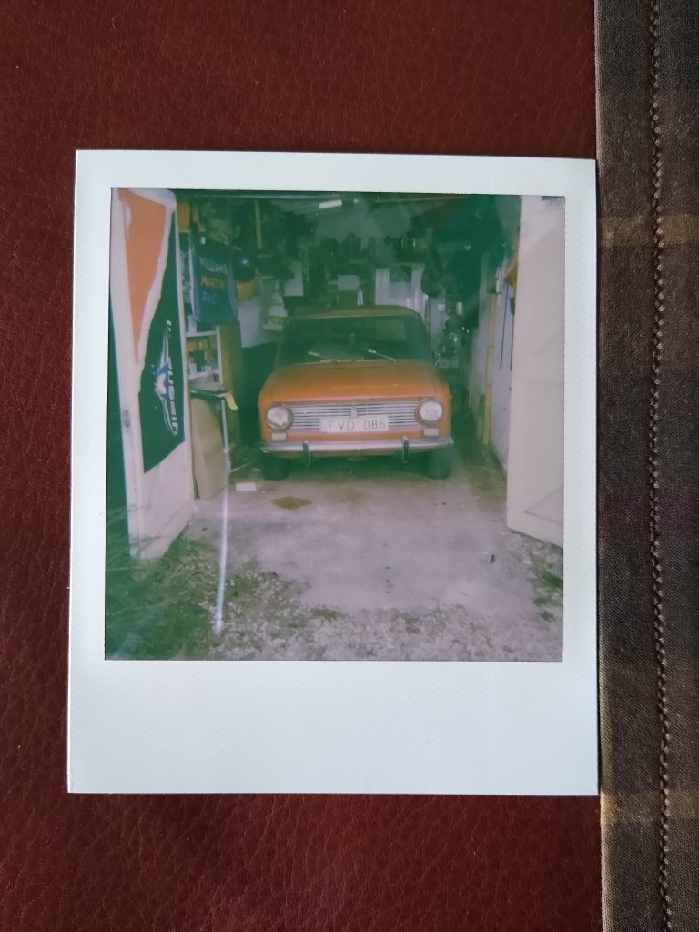 A polaroid photo of my Lada 2101 inside my garage.